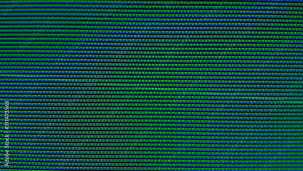 Close-up of the Monitor's Pixels. RGB pixels on the TV during the screening of the film, macro, close-up. Red, blue and green sub pixels create an image on the screen