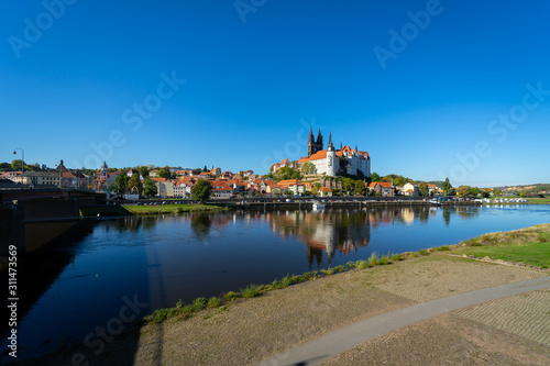 View on the Albrechtsburg castle and the Gothic Meissen Cathedral, the embankment and Elbe river on the foreground. © Sergey Kohl