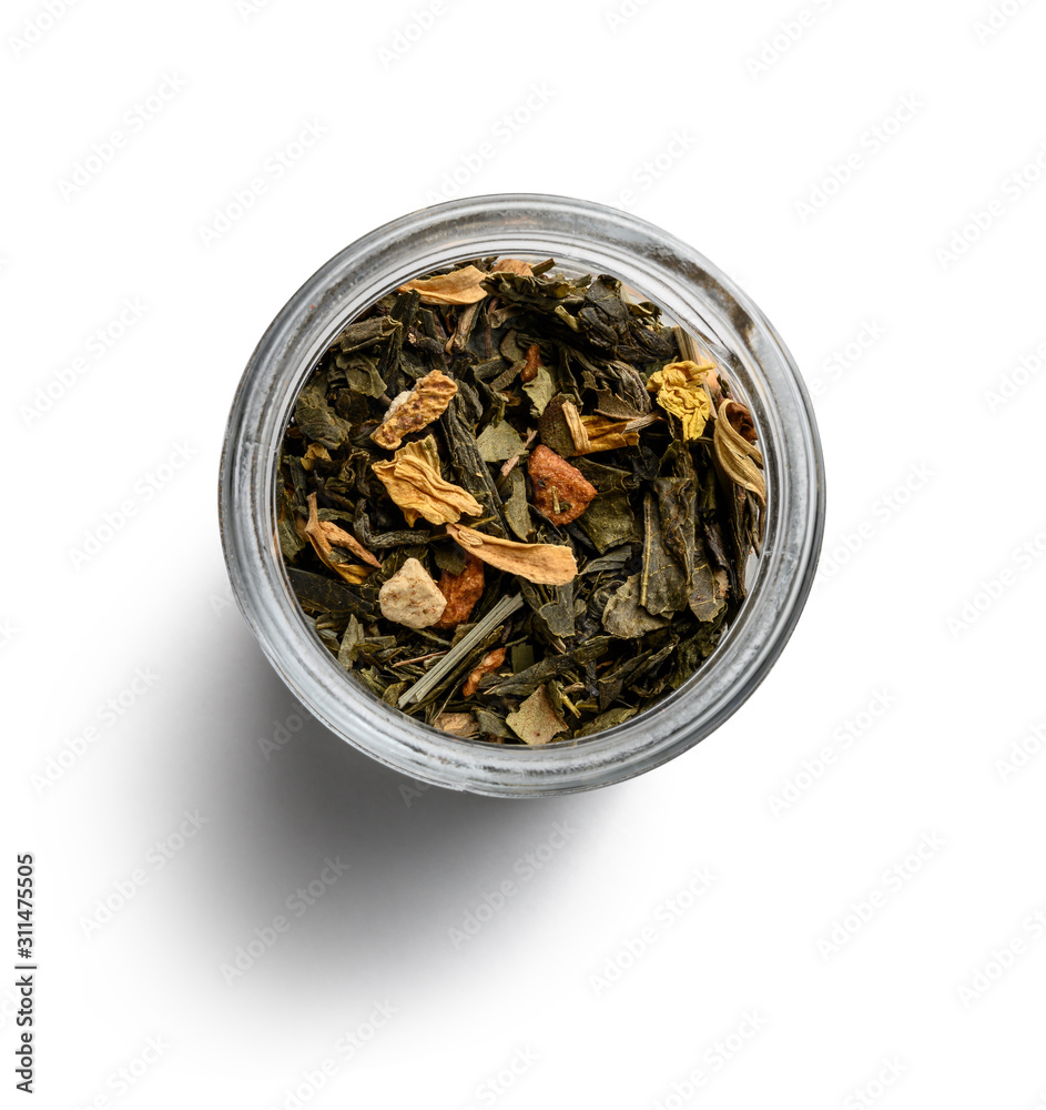 Green tea with aromatic additives. Top view on white background Green tea with aromatic additives. Top view on white background