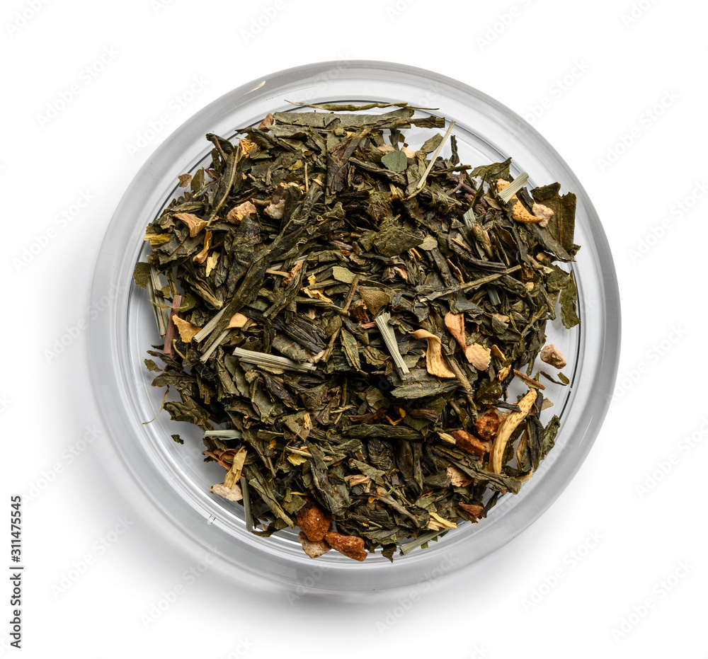 Green tea with aromatic additives. Top view on white background Green tea with aromatic additives. Top view on white background