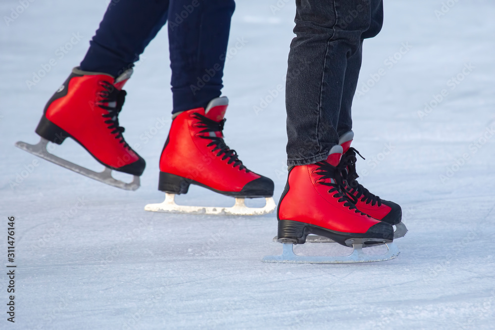 different people are actively skating on an ice rink. Hobbies and sports. Vacations and winter activities. different people are actively skating on an ice rink. Hobbies and sports. Vacations and winter activities.