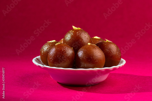 Indian Dessert : Gulab Jamun in white bowl