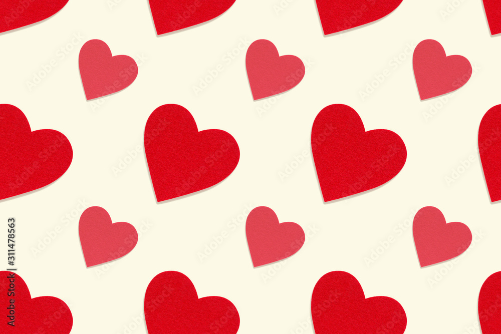 Red heart seamless pattern. Felt texture decorative hearts on pastel cream background