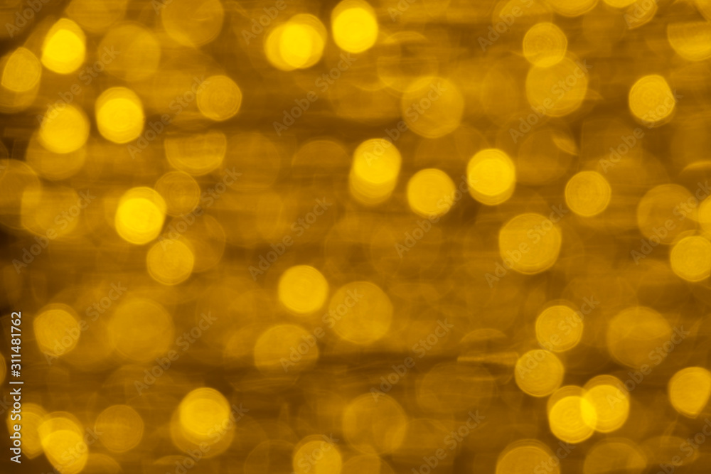 Defocused of blurred golden bokeh circle light from lighting bulb Merry Christmas and Happy New Year decorative in the night for abstract background texture Defocused of blurred golden bokeh circle light from lighting bulb Merry Christmas and Happy New Year decorative in the night for abstract background texture