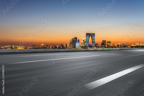 Empty asphalt road through modern city skyline in Suzhou, China © hallojulie