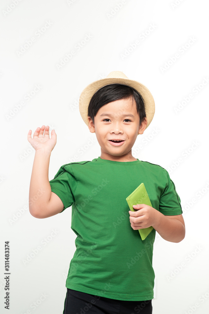Portrait funny in the studio with a children's international passport Portrait funny in the studio with a children's international passport