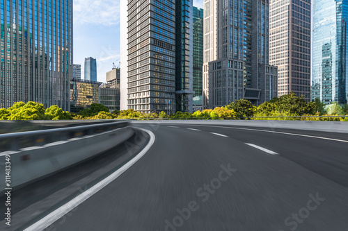 empty road with modern buildings on background  shanghai  china..