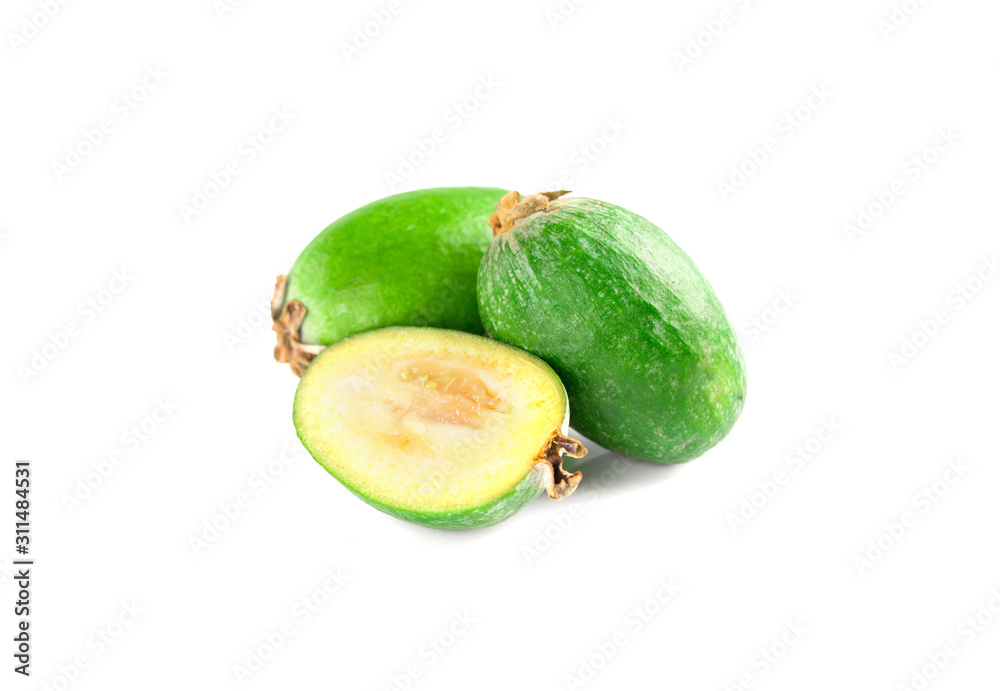 Juicy and ripe feijoa isolated on a white background. Healthy autumn fruit. Juicy and ripe feijoa isolated on a white background. Healthy autumn fruit.