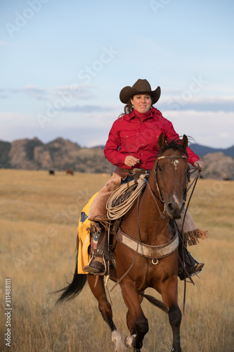 cowgirl riding horse