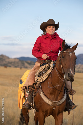 cowgirl riding horse © Terri Cage 