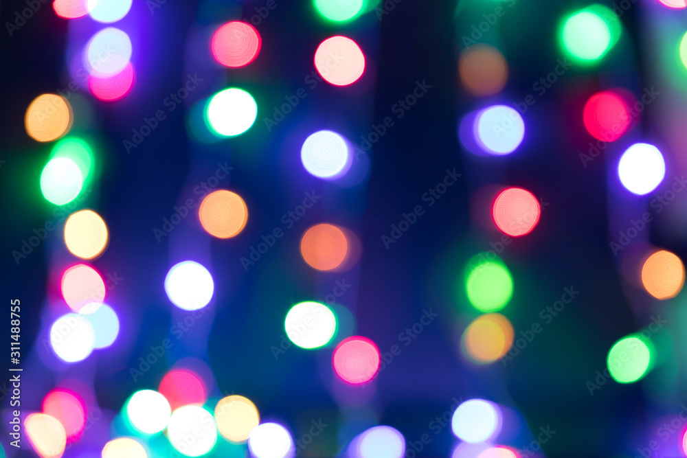 Fototapeta premium Background from the blurred garlands