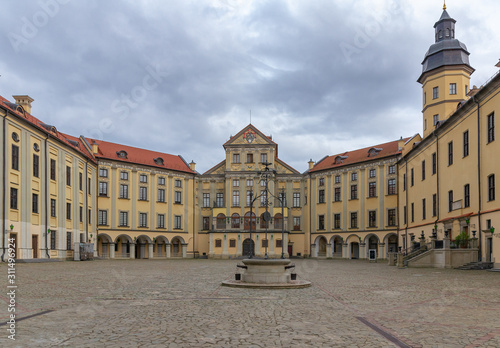 The palace in Nesvizh, Belarus was build in 16-18 centoury under the cloudy sky