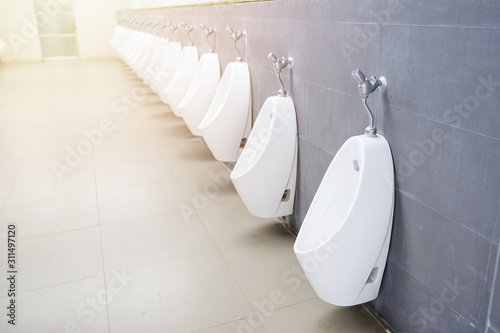 Urinal men in toilet set on beautiful and clean.