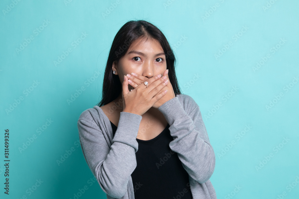 Beautiful young Asian woman close her mouth. Beautiful young Asian woman close her mouth.