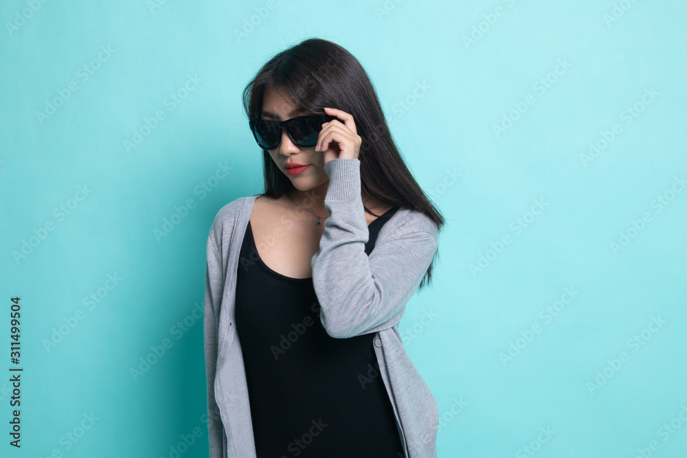 Portrait of a beautiful young asian girl in sunglasses. Portrait of a beautiful young asian girl in sunglasses.