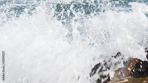 Wallpaper Mural Slow motion of power of waves breaking over rocks on a sunny day. Torontodigital.ca