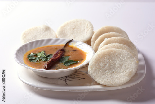 Idli with Sambar and coconut chutney, Indian Dish : south Indian favourite food rava idli or semolina idly or rava idly, served with sambar and green coconut chutney. photo