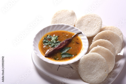 Idli with Sambar and coconut chutney, Indian Dish : south Indian favourite food rava idli or semolina idly or rava idly, served with sambar and green coconut chutney. photo