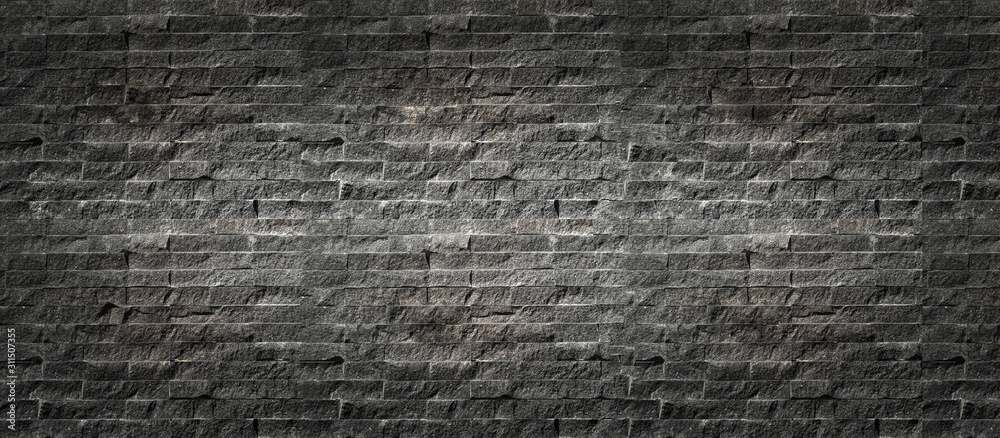 Panorama, Black brick wall background. Old dark stone texture, Abstract surface black rough brick wall pattern. Vintage concrete, cement brickwork. Blank copy space for design backdrop.