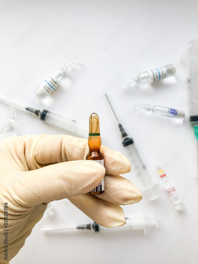 Pharmaceuticals. Antibiotics, syringes, ampoules on a white background. Pharmaceuticals. Antibiotics, syringes, ampoules on a white background.