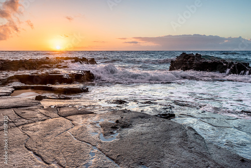 Sunrise over the coral reef at Sandy Beach Park on Oahu, Hawaii