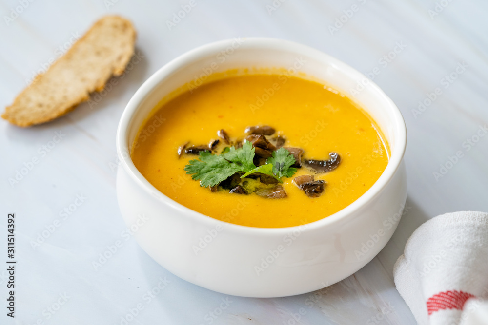 Homemade Thai Sweet Potato Soup with Cilantro, Coconut Milk Cream, Lime and Mushrooms. Homemade Thai Sweet Potato Soup with Cilantro, Coconut Milk Cream, Lime and Mushrooms.
