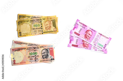 New Indian Currency of Rs.2000 and old currency of Rs.1000 on white background. old currency demonetized and new currency Published on 9 November 2016. photo