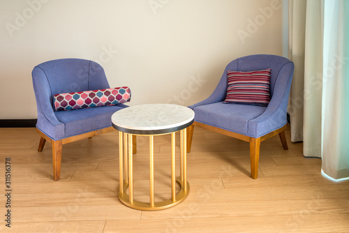 Colored chairs from fabric and suede on a laminate floor © OttoPles