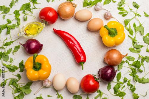 A set of vegetables for a healthy diet, yellow and red peppers, tomatoes, onions, garlic. . photo