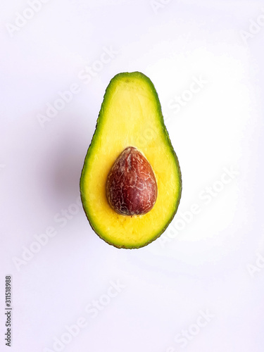 Cut ripe avocado. Isolated on a white background.