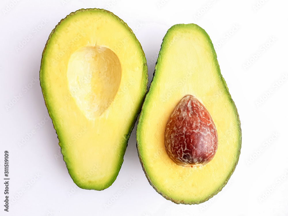 Cut ripe avocado. Isolated on a white background.