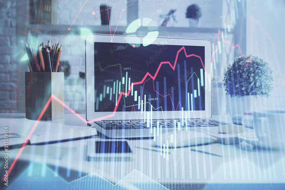 Forex Chart hologram on table with computer background. Double exposure. Concept of financial markets. Forex Chart hologram on table with computer background. Double exposure. Concept of financial markets.