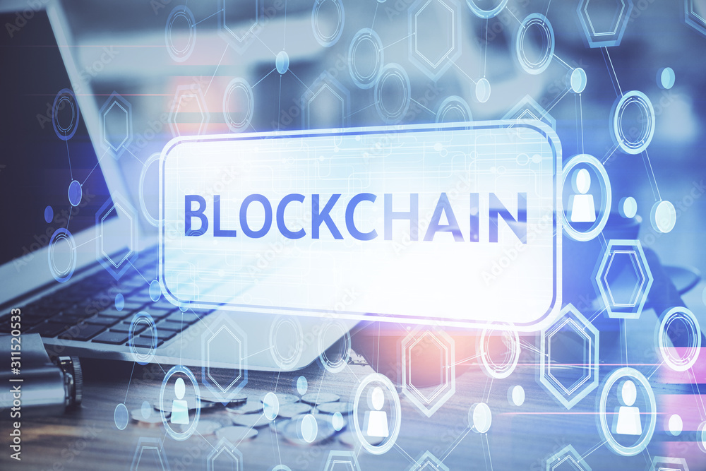 Double exposure of blockchain theme hologram and table with computer background. Concept of bitcoin crypto currency. Double exposure of blockchain theme hologram and table with computer background. Concept of bitcoin crypto currency.
