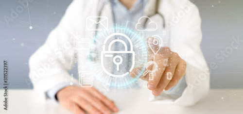Doctor holding a Security padlock wheel icon with multimedia and social media icon 3d rendering
