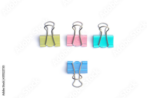 Colered paper clip isolated on white background photo