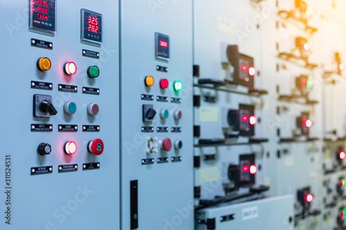 Electrical switch gear at Low Voltage motor control center cabinet  in coal power plant. blurred for background.