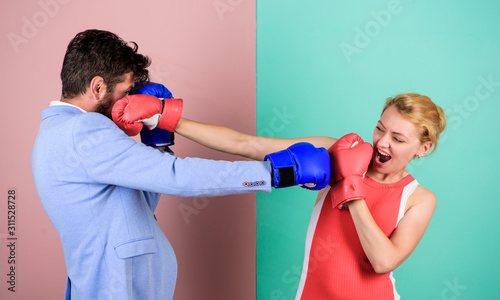 sportswear. knockout punching. who is right. win the fight. Strength and power. bearded man hipster fighting with woman. family couple boxing gloves. problems in relationship. sport