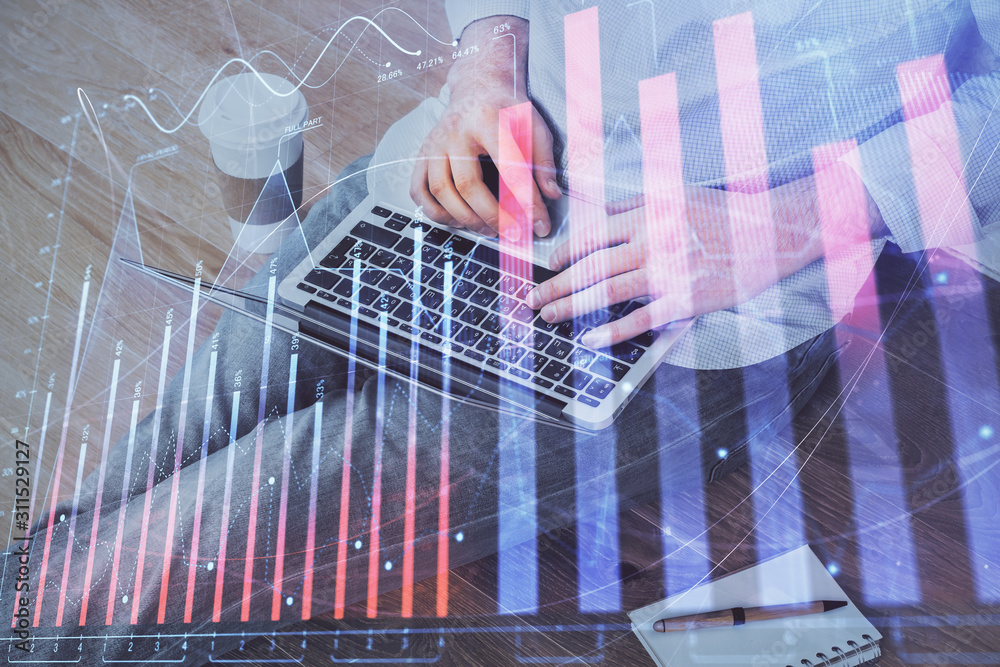 Forex graph with businessman working on computer in office on background. Concept of analysis. Double exposure. Forex graph with businessman working on computer in office on background. Concept of analysis. Double exposure.