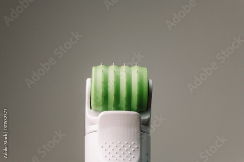 Dermaroller for mesotherapy. The fixture makes anti aging dermis roller. Facial treatment needles. photo