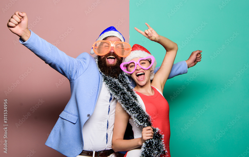 Christmas fun. happy family couple celebrate xmas. santa man and woman with tinsel. merry christmas. preparation to winter holidays. celebrate together. people in party glasses. happy new year party Christmas fun. happy family couple celebrate xmas. santa man and woman with tinsel. merry christmas. preparation to winter holidays. celebrate together. people in party glasses. happy new year party