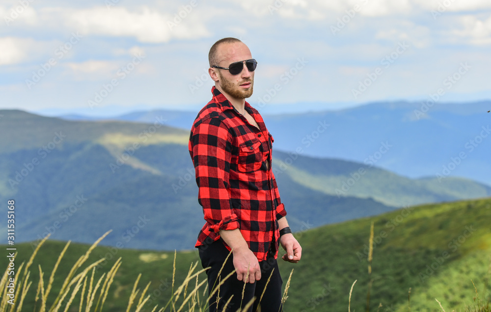 Discover world. Masculinity and male energy. Achieve freedom. Free and wild. Value of freedom. Self sufficient. Man stand on top of mountain. Hiking concept. Active leisure. Guy enjoy freedom Discover world. Masculinity and male energy. Achieve freedom. Free and wild. Value of freedom. Self sufficient. Man stand on top of mountain. Hiking concept. Active leisure. Guy enjoy freedom