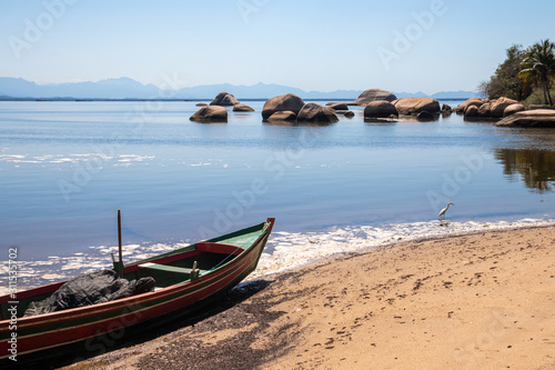 Corner of Catimba   Beach  with fishing boat and rocks in the background  Paqueta  Rio de Janeiro  Brazil
