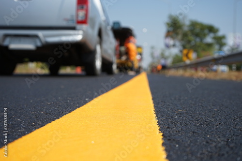 Yellow traffic paint lines during construction phase, blurred pictures