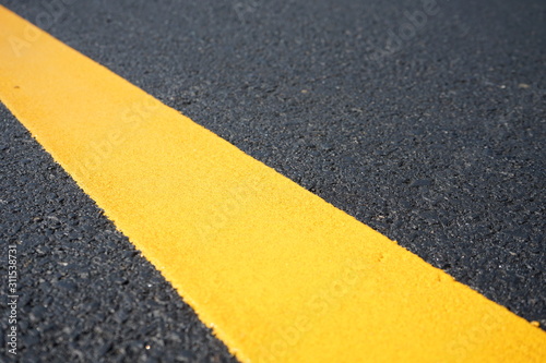 Yellow traffic paint lines during construction phase  blurred pictures