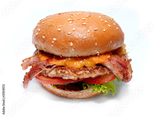 Juicy beef burger with bacon, cheese and salad. photo