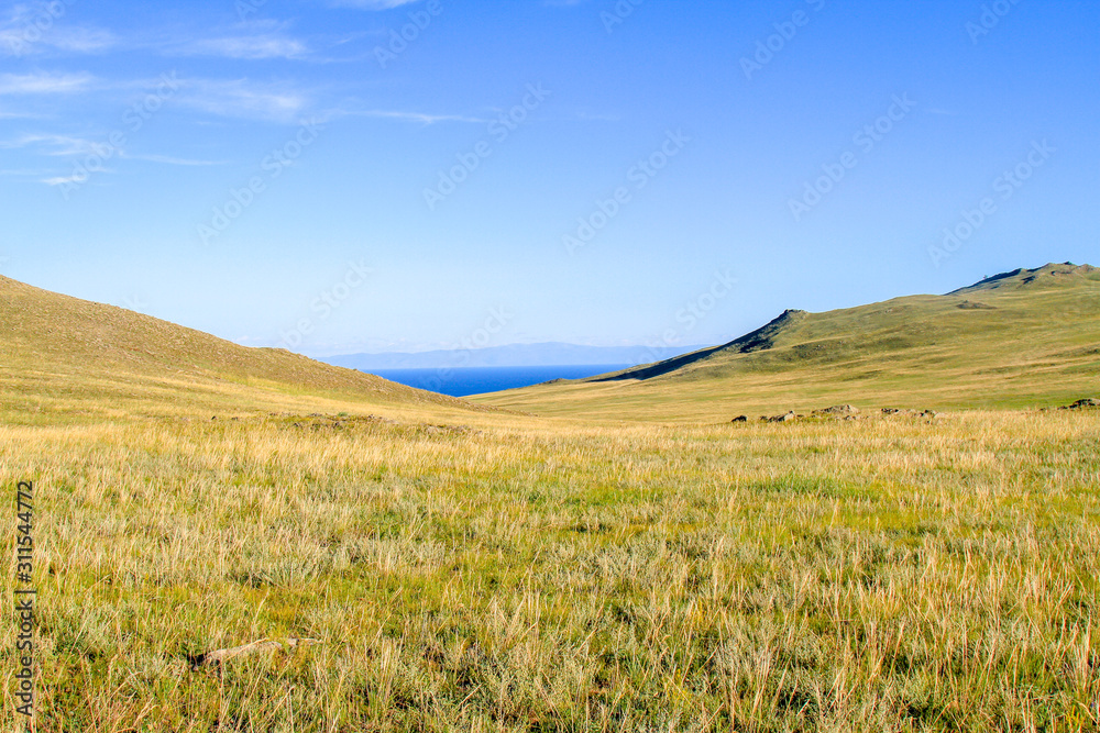 Obraz premium landscape with hills and blue sky and lake