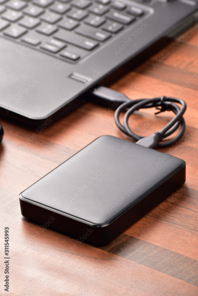 hard disk connected to the laptop on tabel, hhd storage device hard disk connected to the laptop on tabel, hhd storage device