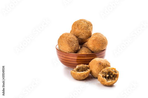 Kachori or Kachauri or Kachodi or Katchuri is a spicy snack, snacks with tea and green salad and tomato ketchup