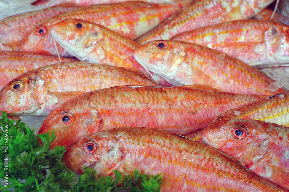 View of red mullet (rouget barbet) fish at a French seafood market View of red mullet (rouget barbet) fish at a French seafood market
