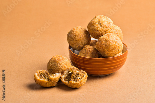 Kachori or Kachauri or Kachodi or Katchuri is a spicy snack, snacks with tea and green salad and tomato ketchup photo